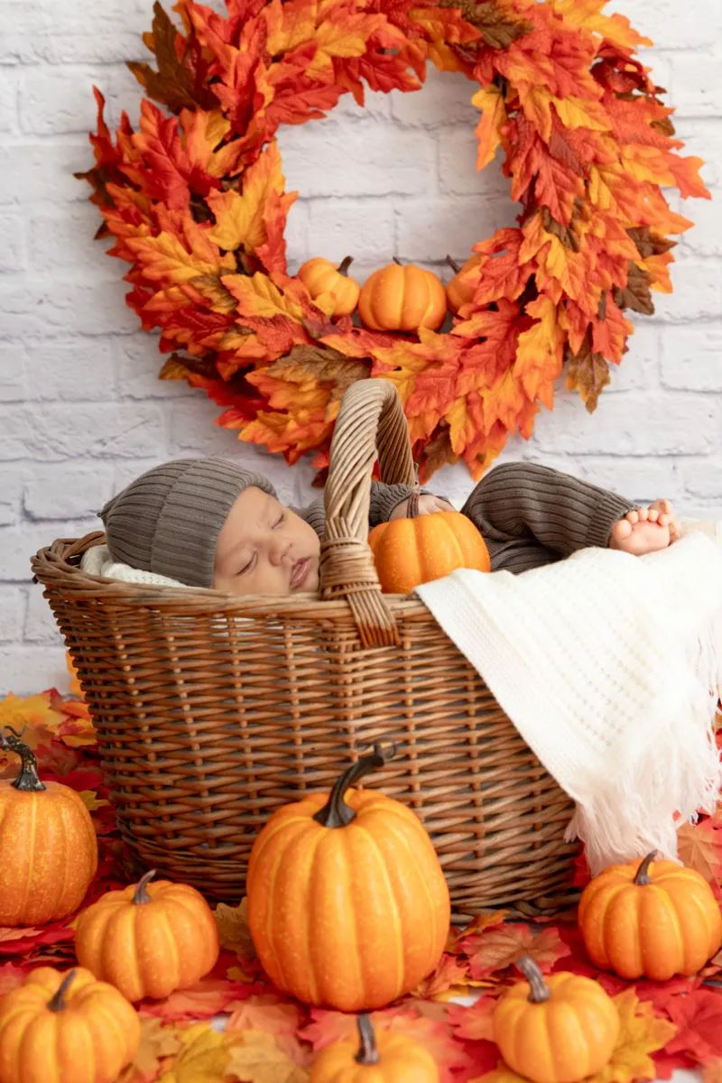 Baby in a Halloween Pumpkin Basket